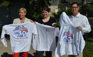 Holly Tuttle, Stacy Shery and Tom Tuttle show off the 2013 Wawasee Flotilla T-shirts which are now available