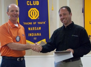 Rick Kerlin, left,  represents the Warsaw Breakfast Optimist Club and presented a check to Troy Burns for the Kosciusko County Soccer League.