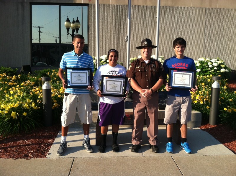 Pictured with Kosciusko County Sheriff's Department Captain Aaron Rovenstine are this year's winners of the Phillip Hochstetler Memorial Scholarships. From left are Zarek Finley, Gabby Monroy and Jordan Acton. (Photo by KCSD Sgt. Chad Hill)