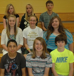 Several Wawasee Middle School eighth-graders will have artwork displayed in the main lobby of the school until they graduate from high school. In front, from left, are Sebastian Urrutia, Kollin Bell and Sam Griner. In the middle row are Kelsey Swartz (she will have two pieces displayed), Bridgette Yoder and Madison Coy. And in the back row are Maggie Wood, Treasure Minnix and Caleb Bolt. Not pictured is Madison Beaman. (Photo by Tim Ashley)