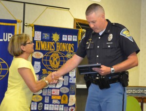 At Monday night’s Milford Town Council meeting, Rebecca Kubacki provided Indiana State Trooper Kyle Dukes with special recognition for his efforts in getting signs put up to memorialize local World War II veteran Harry Michael. (Photo by Dani Molnar)