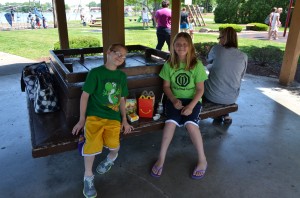 (left to right) Brandon Dunn, 11, and McKenzie Dunn, 12, enjoy a packed lunch from McDonald's while at Kiddieland Park. Starting Thursday, June 6, parents will be able to take their children to receive a free lunch provided by WCS at several parks and schools around Warsaw. (photo by Alyssa Richardson) 