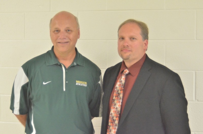 Wawasee athletic director Steve Wiktorowski (at left above) was named the new boys basketball coach for the Warriors Tuesday night. At right is Wawasee High School principal Mike Schmidt (Photo by Nick Goralczyk)