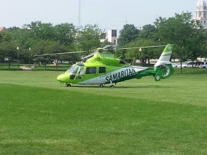 Samaritan lands in Central Park to airlift a patient who was struck by a vehicle at Center and Detroit streets. (Photo by Alyssa Richardson)
