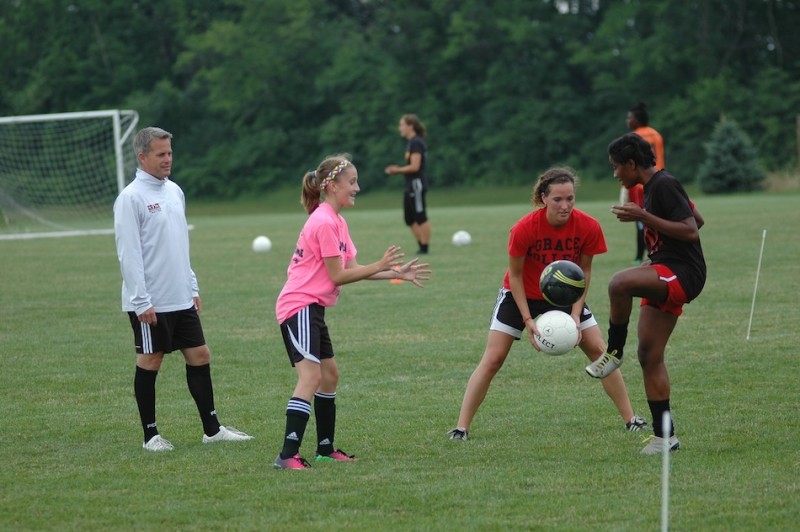 Soccer players take part in a clinic at Grace College. The free clinics for girls ages ......, are held each Monday night at Miller Field (Photo provided by Grace College Sports Information Department)