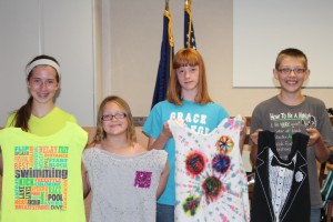 Better than recycling is reusing and repurposing. Teens brought old t-shirts to the library and turned them into bags (From left): Sailor Davis-york, Lanie Gross, Kandy Jensen and Garrett Smith.  (Photo provided)