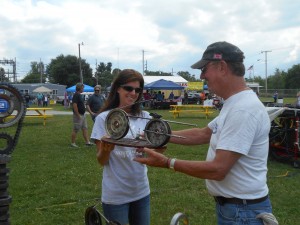 Michelle Fisher presents a trophy to John Drummond. Drummond won the Best Vintage class in the bike portion of the show. Drummond purchased his motorcycle in 1968, but before Saturday, he had never won an award for his bike. However, in a turn of events, Drummond won at the Dixie Days Car and Bike Show after he had finalized the bike’s sale that very morning. Drummond was very grateful to the judges and their decision. (Photo by Stephanie Loney)