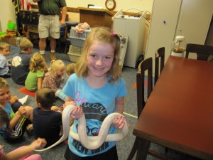 Cali Simmons was the lucky girl that got to walk the yellow corn snake around the room when Mark’s Ark visited the Syracuse Library. There are 3 more weeks of Terrific Tuesdays and everyone is invited. (Photo provided)