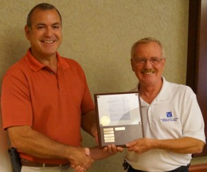 From left are Kurt Carver, KREMC operations manager, and Doug Shidler, Federated Rural Electric Insurance Exchange. (Photo by Katy Stegall)