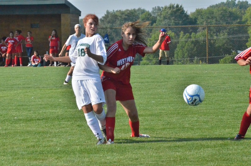 Wawasee's Natalie Jones gets physical with West Noble's Jocelyn Rivera. Rivera scored twice for the Chargers Wednesday night.