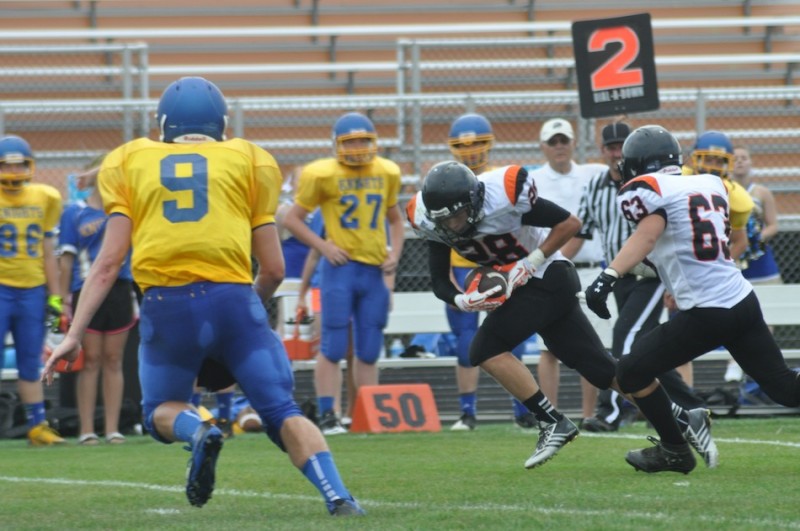Tyler Packard heads upfield for Warsaw in junior varsity football action Saturday. Packard scored on a fumble return as the Tigers topped East Noble 17-0 (Photos by Amanda Farrell) 
