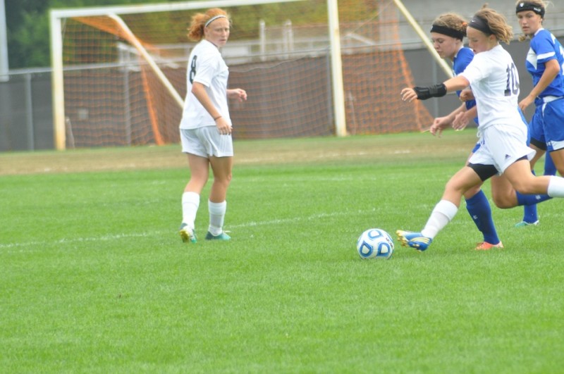 Warsaw's Elizabeth VanWormer battles for the ball versus Marian Saturday. The Tigers tied the defending state champions 2-2 (Photos by Amanda Farrell)