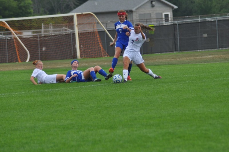 Julie Frazzetta of Warsaw tries to control the ball Saturday.