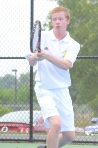 Caleb Ray follows his backhand return at No. 3 singles Monday for Warsaw. Ray won 6-2, 6-2 as the Tigers topped Marian 4-1.