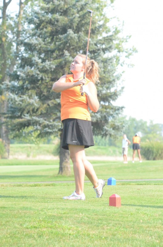 Warsaw senior Nikki LaLonde watches her tee shot Tuesday. LaLonde earned medalist honors with a 39 in NLC action at McCormick Creek in Nappanee (Photos by Scott Davidson)