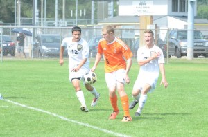 Sam Allbritten works to control the ball versus a pair of Penn defenders. Allbritten had a goal in the 2-2 tie Saturday.
