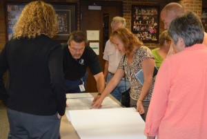 Pat Moore, with INDOT Real Estate, goes over the plans with Cindy Brown and others. (Photo by Deb Patterson)