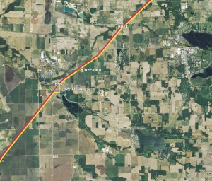 LOCAL ROUTE — This map shows the approved Reynolds-Topeka transmission line, shown in yellow, as it travels through Van Buren Township and into Elkhart County. The red line is the existing high powered transmission line.  Point one shows the deviation from the existing line. This shows the area at CR 1150N and Old SR 15, at the south edge of Milford. The line will go over property owned by J & S Beer Farms and property owned by Barth Property LLC, Barb Barth. The line will go over the property owned by Logan S. Messer at 234 E. CR 1150N or the property of David and Linda Miller at 306 E. CR 1150N before heading north over farmland owned by Steven and Constance Beer.  Point two shows where the line will deviate is near where it crosses Beer Road, east of Milford. Here the line will take an easterly turn over property owned by Sharyl Sue Flechter, Kristen A. Beer and Amy M. Beer and going behind property of Rex Leroy Tinkey and property owned by Dan and Deb Beer. The line will head along the east edge of the Tinkey/Beer property going north over Beer’s property back to following the existing line. (Map provided by NIPSCO)