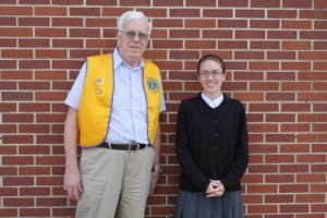 Richard Tuttle of the Warsaw Evening Lions Club congratulates Megan Rangel on receiving the Warsaw Evening Lions Club Scholarship. (Photo provided)