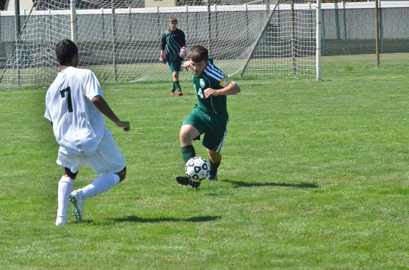 Wawasee's Michael Pena (14) clears the ball away from Concord's Julio Solano. (Photos by Nick Goralczyk)