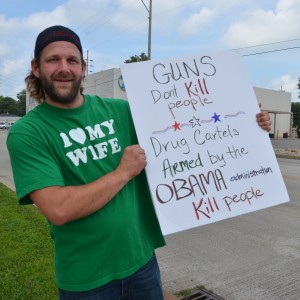 Justin Risner, of Warsaw, hosted a public protest today calling for the impeachment of President Obama along SR 15 near Center Lake. (Photo by Alyssa Richardson)