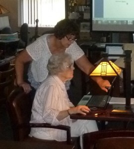 Adult Services Director Beth Smith (standing) assists Norma Roose during a recent Microsoft Word Class at the North Webster Public Library. (Photo provided) 