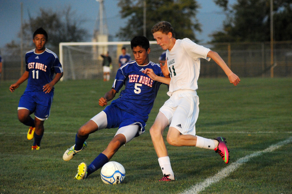 West Noble's Alejandro Flores and Wawasee's Carter Jones square off for a loose ball during West Noble's 6-0 victory Thursday night in Syracuse. (Photos by Mike Deak)