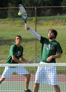 Jake Hutchinson of Wawasee volleys home a shot while doubles mate Doug Hapner covers.