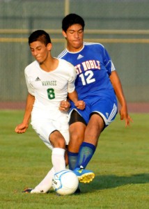 Wawasee's Luis Camargo tangles with West Noble's Daniel Silva.