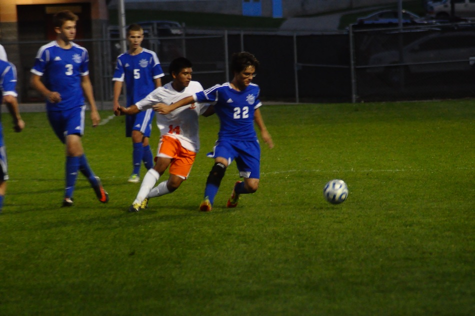 Miguel Rivera of Warsaw and Cruz Garcia of Canterbury work for possession Tuesday night. 