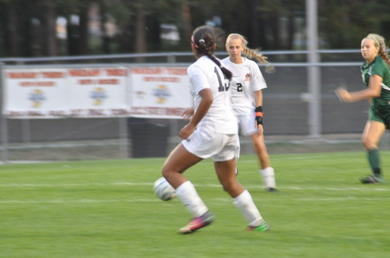 Danielle Hutcherson (No. 2) works the ball with teammate Vanessa Malagon versus Concord Thursday night. Hutcherson scored the lone goal in a big 1-0 NLC win for the Tigers (Photos by Amanda Farrell)