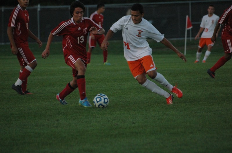 Manuel Rodriguez of Warsaw (right) and Seth Kurtz of Goshen battle for the ball at WCHS Thursday night.