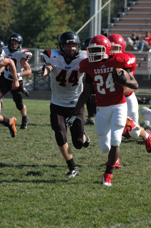 Warsaw's Dylan Childers chases down a Goshen player Saturday during JV football action. Childers led the Tigers with 11 tackles in an 18-13 win (Photos by Amanda Farrell)