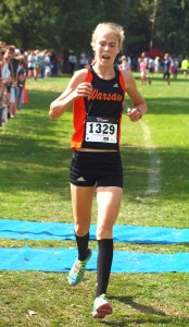 Warsaw freshman Allison Miller crosses the finish line Saturday to win the Open Division race at the Culver Academies Invitational. Miller led the Tigers to the team championship (Photos by Tim Creason)