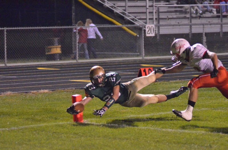 Clayton Cook dives for his second of four touchdown receptions on the night. (Photos by Nick Goralczyk)