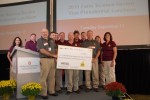 Representatives of Trupointe Cooperative, United Landmark LLC, Heritage Cooperative, Jackson Jennings Co-op and Town & Country Co-op Cooperative present a $138,637.13 check to Drs. Steven Schwartz and Steven Clinton for food-based cancer research at OSU. 