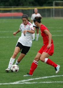 Grace College's Mallory Rondeau works her way through the St. Xavier defense Saturday in a 2-0 win. (Photo provided by Grace College Sports Information)