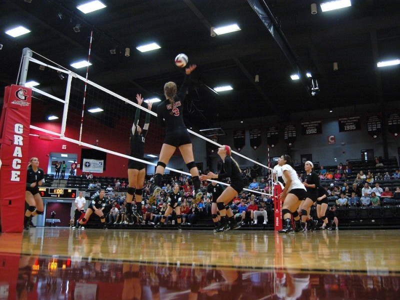 Grace College freshman Megan Johnson skies for an attack during a 3-0 conference win over Huntington at home Friday night (Photo provided by Grace College Sports Information Department)