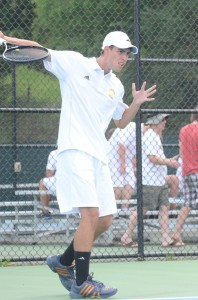 Warsaw senior Kyle Wettschurack  finishes a backhand in a match earlier this season. Wettschurack helped Warsaw beat Northridge 3-2 Tuesday with a win at No. 1 doubles (File photo by Scott Davidson)