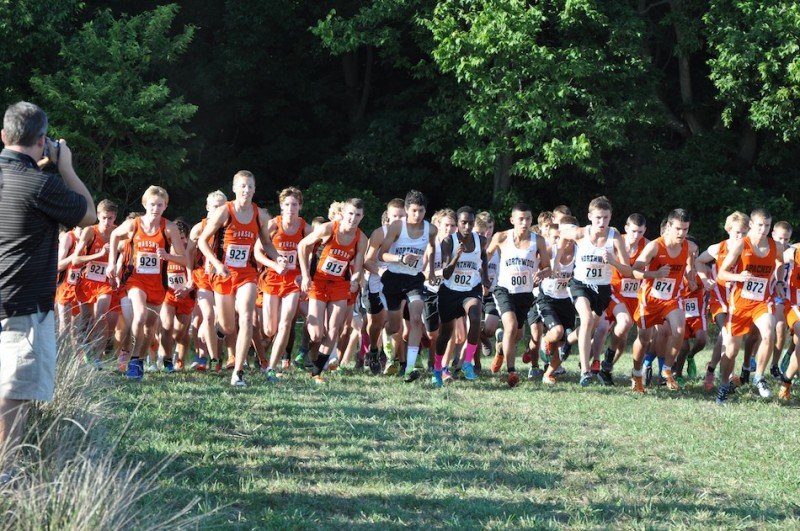 The Warsaw boys' cross country team takes off at the start of the Tiger Classic Tuesday (Photo by Amanda Farrell)