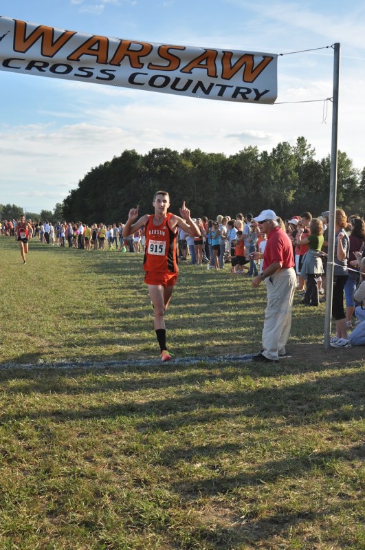 Warsaw standout Ellis Coon crosses the finish line first Tuesday  in the Tiger Classic. Coon led the host Tigers to the team title (Photo by Amanda Farrell)