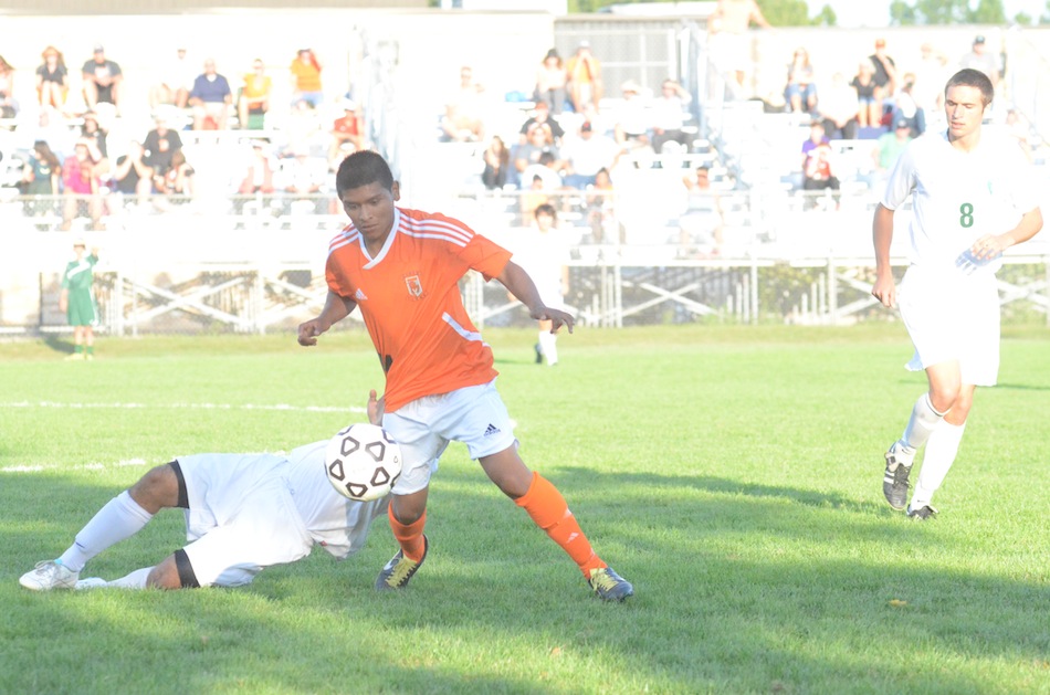 Warsaw senior Miguel Rivera controls the ball versus Concord Wednesday. The No. 4 Tigers rallied for a 1-1 tie in the pivotal NLC match (Photos by Scott Davidson)