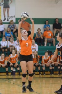Warsaw's Megan Chauncey sets the ball at Northridge Tuesday night. The Tigers lost 3-0 to the Raiders in NLC action (Photos by Scott Davidson)
