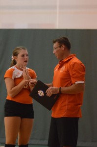 Warsaw volleyball coach Mike Howard talks with Megan Chauncey during a timeout Tuesday.