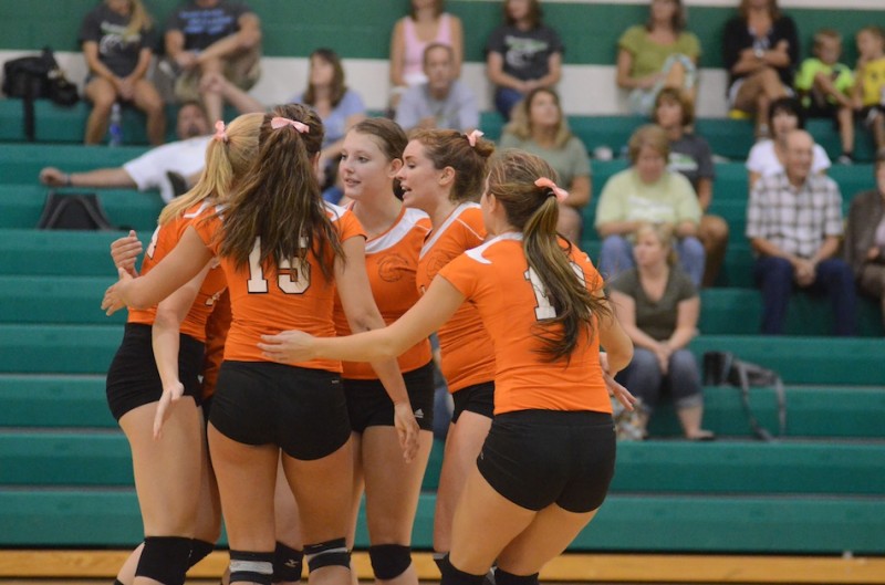 The Warsaw volleyball team  comes together during its match at Northridge Tuesday night.