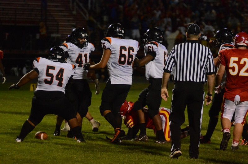 Fullback Jason Taylor (No. 41) is congratulated by his offensive line after a third quarter touchdown for the Tigers Friday night.