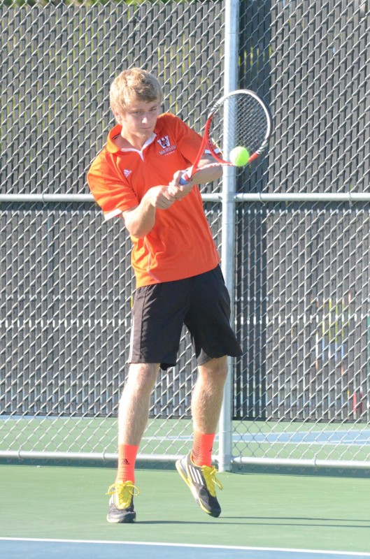 Warsaw's Sam Rice makes a backhand return at No. 1 singles Monday versus Penn. The No. 22 Kingsmen topped the host Tigers 4-1 (Photos by Scott Davidson) 
