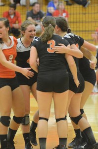 Warsaw celebrates during a 3-2 conference volleyball win over Plymouth Thursday night (Photos by Scott Davidson)