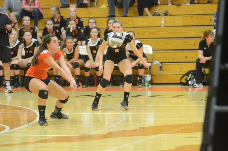 Warsaw senior libero Marie West passes the ball versus Plymouth Thursday night.