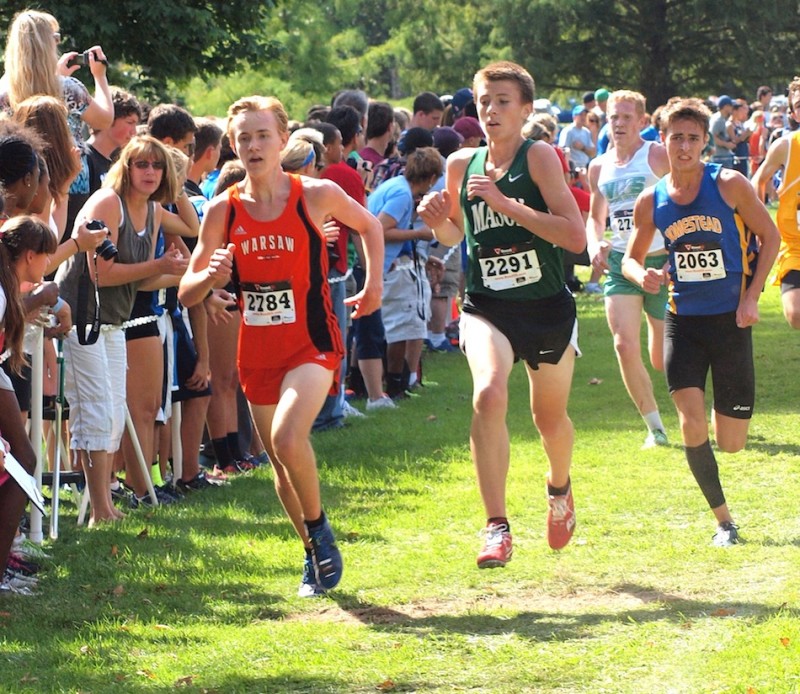Warsaw's Daniel Messenger leads a trio of runners Saturday.